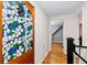 Hallway boasts a decorative door with stained glass and a view into the other rooms at 35 S Albion St, Denver, CO 80246