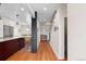 Hallway featuring hardwood floors and leading to a kitchen and stairs to the second floor at 35 S Albion St, Denver, CO 80246