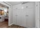 A laundry room featuring bright white cabinets for ample storage at 35 S Albion St, Denver, CO 80246
