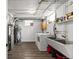 Bright laundry room featuring modern washing machine and utility sink at 35 S Albion St, Denver, CO 80246