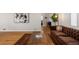 Living room with hardwood floors, a patterned area rug, a sofa and a rustic wood coffee table at 35 S Albion St, Denver, CO 80246