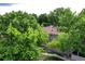 Aerial image of a residential property with mature trees and green common areas at 7925 W Layton Ave # 605, Littleton, CO 80123