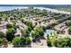 Lush landscaping surrounds the community pool and tennis courts, seen from an aerial view at 7925 W Layton Ave # 605, Littleton, CO 80123