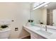 Clean, bright bathroom features quartz countertop, updated fixtures, and neutral paint at 7925 W Layton Ave # 605, Littleton, CO 80123