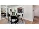 Inviting dining room with a modern light fixture, stylish decor, and wood flooring at 7925 W Layton Ave # 605, Littleton, CO 80123