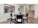 Inviting dining room with a modern light fixture and view of the kitchen at 7925 W Layton Ave # 605, Littleton, CO 80123