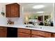Well-equipped kitchen features quartz countertops and a view of the living area at 7925 W Layton Ave # 605, Littleton, CO 80123