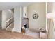 Inviting living space featuring hardwood floors, a cozy fireplace, and access to a staircase, offering a modern aesthetic at 7925 W Layton Ave # 605, Littleton, CO 80123