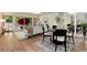 Open living space features hardwood floors, ample natural light and access to the outdoors at 7925 W Layton Ave # 605, Littleton, CO 80123