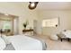 Spacious primary bedroom with neutral tones, including view to the hall, and comfortable furniture at 7925 W Layton Ave # 605, Littleton, CO 80123
