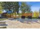 Large backyard featuring a playground, fire pit, and an outdoor kitchen at 8242 E Briarwood Pl, Centennial, CO 80112
