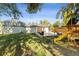 Wide angle image of backyard featuring a custom play structure and patio at 8242 E Briarwood Pl, Centennial, CO 80112