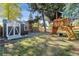 Image of spacious backyard featuring a storage shed and custom play structure at 8242 E Briarwood Pl, Centennial, CO 80112