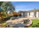 Well maintained backyard featuring a patio, built-in seating, a grill, and mature landscaping at 8242 E Briarwood Pl, Centennial, CO 80112