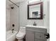 Beautifully renovated bathroom featuring modern fixtures, tiled walls and a shower-tub combo at 8242 E Briarwood Pl, Centennial, CO 80112