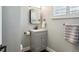 Bathroom features gray vanity, modern fixtures, and square mirror at 8242 E Briarwood Pl, Centennial, CO 80112