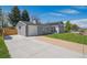 Charming two-story home with well-maintained lawn and long driveway at 8242 E Briarwood Pl, Centennial, CO 80112