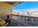 Relaxing outdoor balcony with comfortable seating and views of the surrounding neighborhood at 9471 Ashbury Cir # 202, Parker, CO 80134