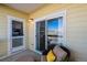 Cozy balcony with comfortable seating, ideal for enjoying the outdoors and neighborhood views at 9471 Ashbury Cir # 202, Parker, CO 80134