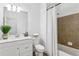 Well-lit bathroom featuring a shower/tub combo and vanity sink with marble countertop at 9471 Ashbury Cir # 202, Parker, CO 80134