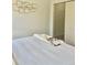 Bright bedroom features neutral tones, a comfortable bed, and closet for ample storage at 9471 Ashbury Cir # 202, Parker, CO 80134