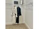 Walk in closet with shelving, rods and carpeted floor at 9471 Ashbury Cir # 202, Parker, CO 80134