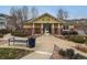 Charming community clubhouse with yellow siding, stone accents, and a welcoming entrance at 9471 Ashbury Cir # 202, Parker, CO 80134