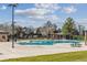 A sparkling blue community pool with lounge chairs awaits residents on a hot summer day at 9471 Ashbury Cir # 202, Parker, CO 80134