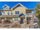 Charming two-story townhome with stone accents and a cozy front porch at 9471 Ashbury Cir # 202, Parker, CO 80134