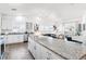 Modern kitchen featuring granite countertops, stainless steel appliances, and open layout into the living space at 9471 Ashbury Cir # 202, Parker, CO 80134