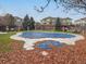 Covered community pool surrounded by autumn foliage, providing a serene and private setting at 9471 Ashbury Cir # 202, Parker, CO 80134