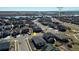 Aerial view of a neighborhood near Peninsula Park with a body of water in the background at 4863 River Landing Ave, Firestone, CO 80504