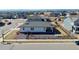 Aerial view of a modern house surrounded by many more homes and landscaping at 4863 River Landing Ave, Firestone, CO 80504
