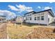 Backyard featuring a lawn, a swing set, and a modern home design at 4863 River Landing Ave, Firestone, CO 80504