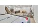 Finished basement featuring an air hockey table, ping pong table, stairs, and living area at 4863 River Landing Ave, Firestone, CO 80504