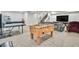 Finished basement featuring ping pong and foosball tables, plus a TV and seating at 4863 River Landing Ave, Firestone, CO 80504