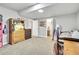 Carpeted basement bedroom showcasing ample space and access to additional rooms at 4863 River Landing Ave, Firestone, CO 80504