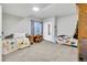 Finished basement bedroom featuring carpeting, a desk area, and an egress window for natural light at 4863 River Landing Ave, Firestone, CO 80504