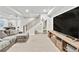 Finished basement with entertainment area and stairs at 4863 River Landing Ave, Firestone, CO 80504