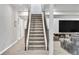 Basement stairway with adjacent entertainment area at 4863 River Landing Ave, Firestone, CO 80504