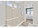 Beautiful bathroom with glass shower and bench at 4863 River Landing Ave, Firestone, CO 80504