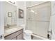 Clean bathroom featuring granite vanity top and sliding glass shower doors at 4863 River Landing Ave, Firestone, CO 80504