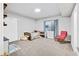 Finished basement bedroom with natural light, a comfortable bed, and cozy reading nook at 4863 River Landing Ave, Firestone, CO 80504