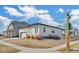 Modern home with a xeriscaped yard and partial fence near street corner at 4863 River Landing Ave, Firestone, CO 80504