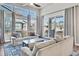 Bright living room featuring large windows, sliding glass door, and comfortable seating at 4863 River Landing Ave, Firestone, CO 80504