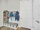 Cozy mudroom features coat hooks, bench with storage baskets, and a convenient shoe organizer at 4863 River Landing Ave, Firestone, CO 80504
