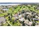 Scenic aerial view of property backing up to the golf course and lake at 3930 S Pinehurst Cir, Denver, CO 80235