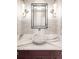 Stylish powder room featuring designer fixtures, marble countertop, vessel sink, and modern accents at 3930 S Pinehurst Cir, Denver, CO 80235