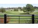Scenic golf course view from a balcony with manicured green grass and mature trees at 3930 S Pinehurst Cir, Denver, CO 80235