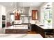 Modern kitchen featuring granite countertops, stainless steel appliances, and custom cabinetry at 3930 S Pinehurst Cir, Denver, CO 80235